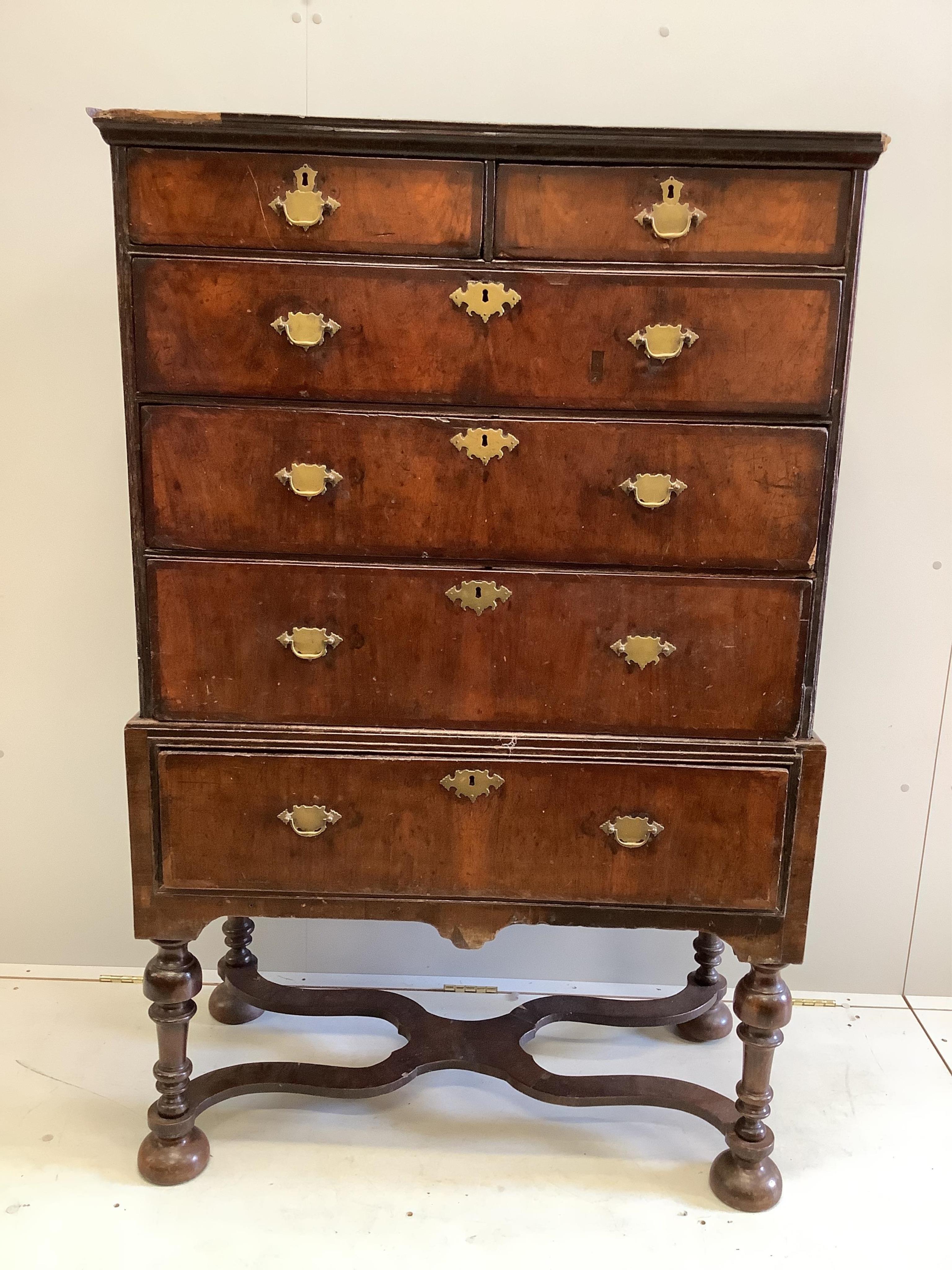An 18th century walnut chest on stand, width 98cm, depth 50cm, height 152cm. Condition - fair
